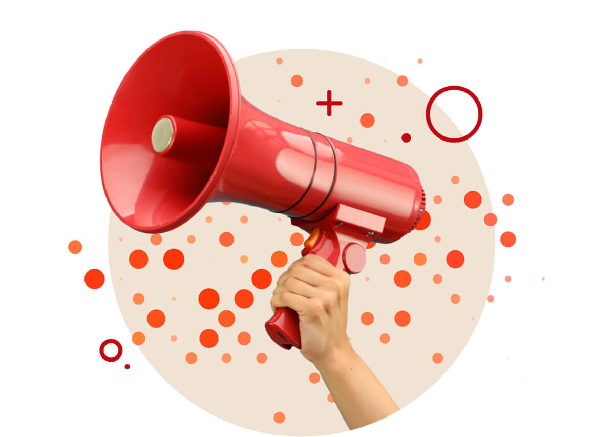 Hand holding a bright red megaphone with an abstract background of orange circles.